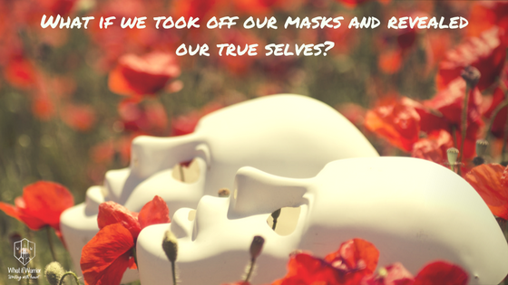 Two masks laying in a field of flowers